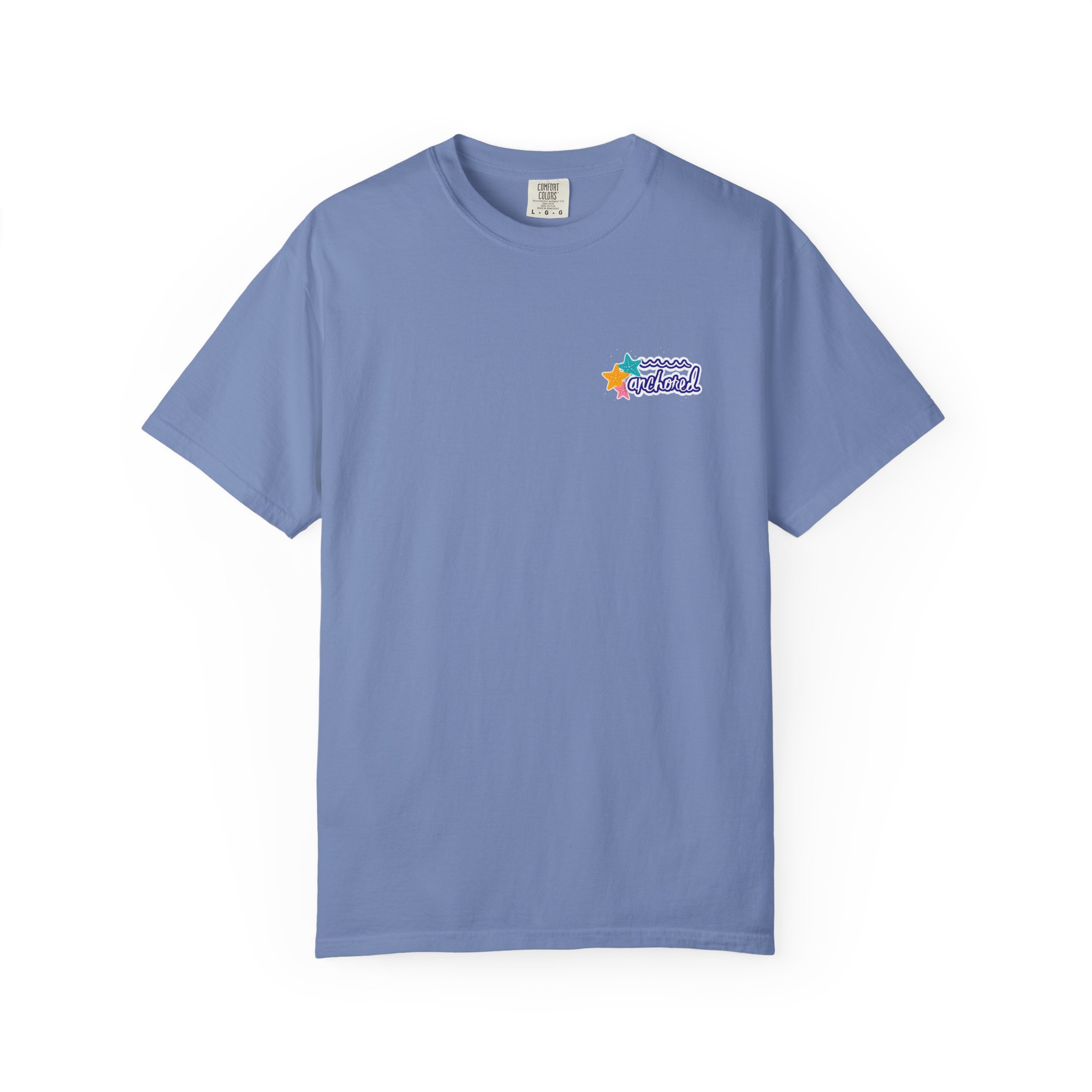4756177653009885855_2048jpeg - Anchored Light blue T-shirt with a small colorful beach-themed graphic on the left chest featuring stars and waves and the word 'Anchored'.
