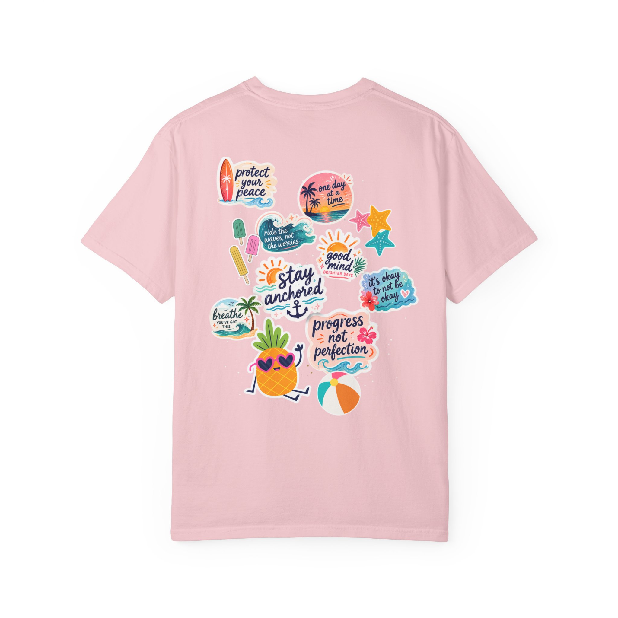 5491304043579707799_2048jpeg - Anchored Back of a light pink T-shirt covered with colorful summer-themed stickers, including a surfboard, palm trees, sun, and playful phrases.