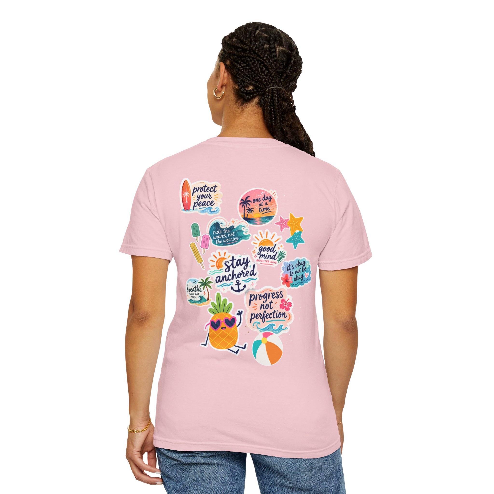 9741047445873314824_2048jpeg - Anchored Back view of a person wearing a pink T-shirt with colorful stickers and designs visible on the back edge of the shirt, braided hair cascading down the back.
